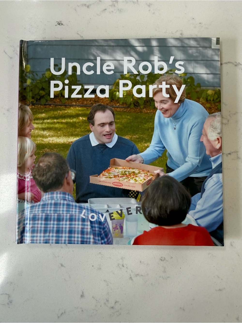 Lovevery Uncle Rob’s Pizza Party Hardcover Book from Problem Solver Kit Learn
